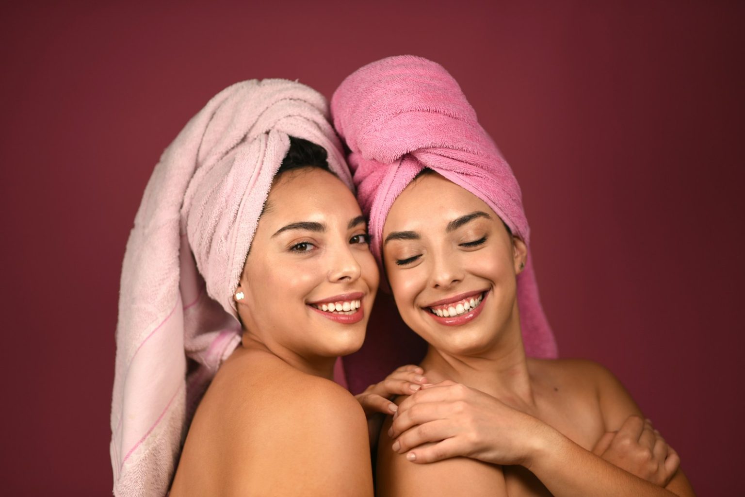 Smiling client after beauty treatment at Glamour Skin Salon in Palos Heights, IL, sharing a positive review.